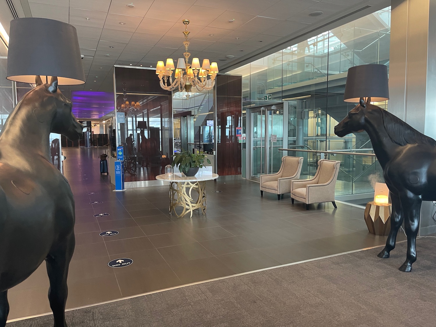 a large black horse statues in a lobby