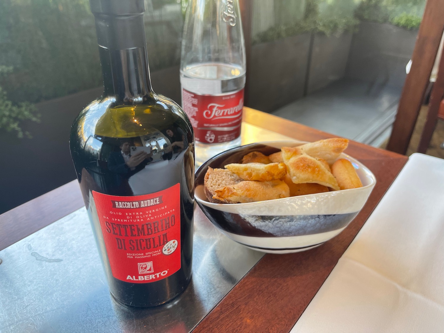 a bowl of bread and a bottle of wine