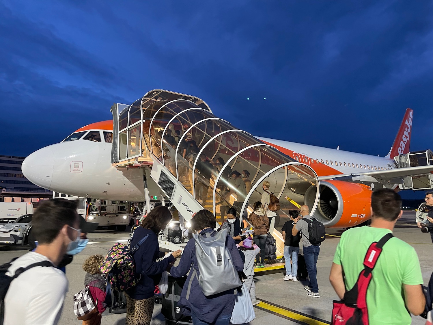 a group of people boarding an airplane