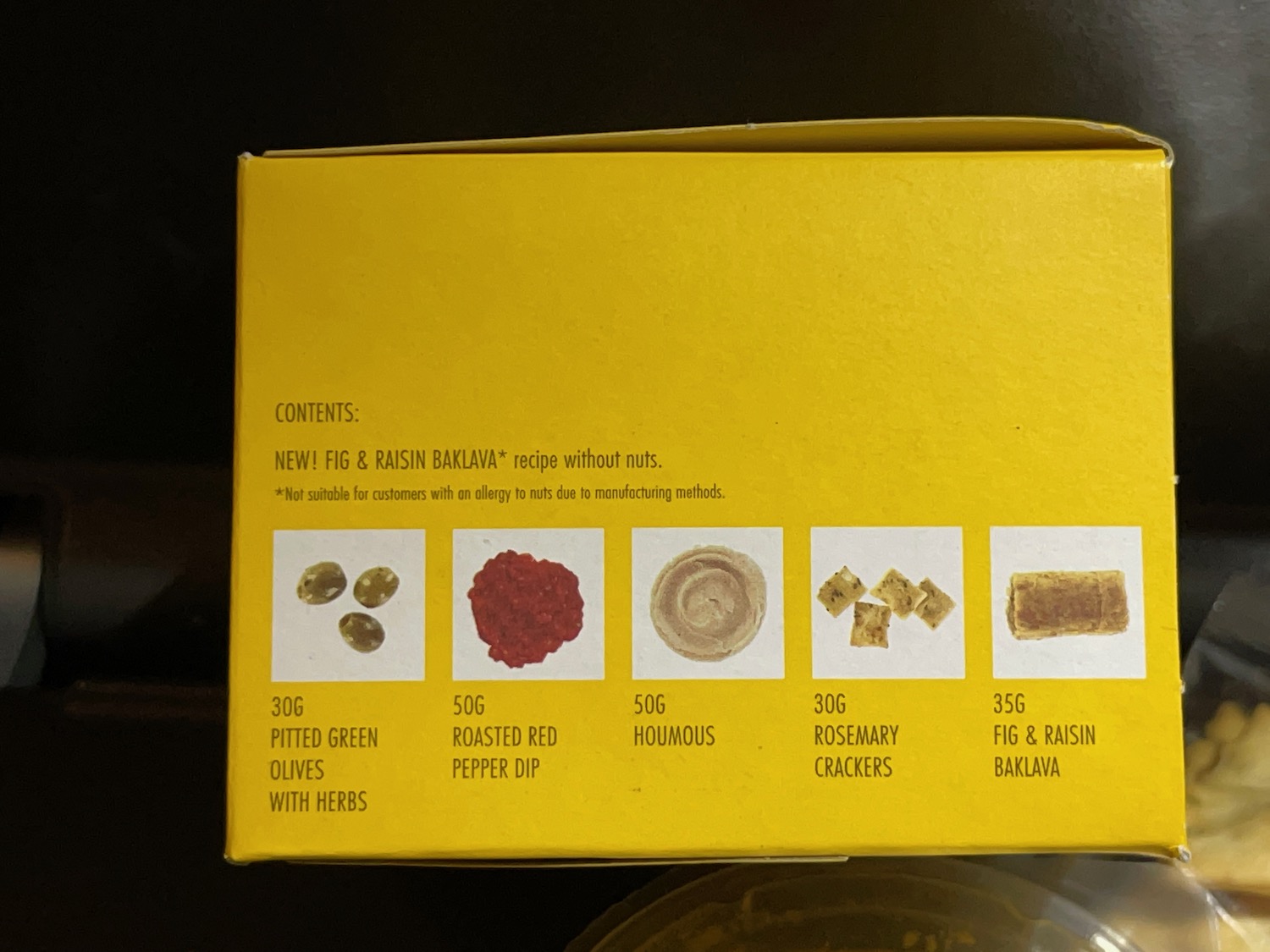 a yellow box with different types of food on it