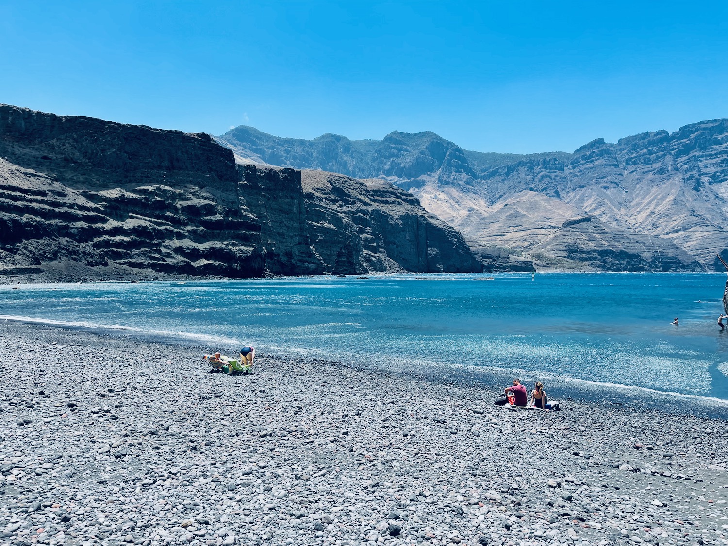 people on a rocky beach