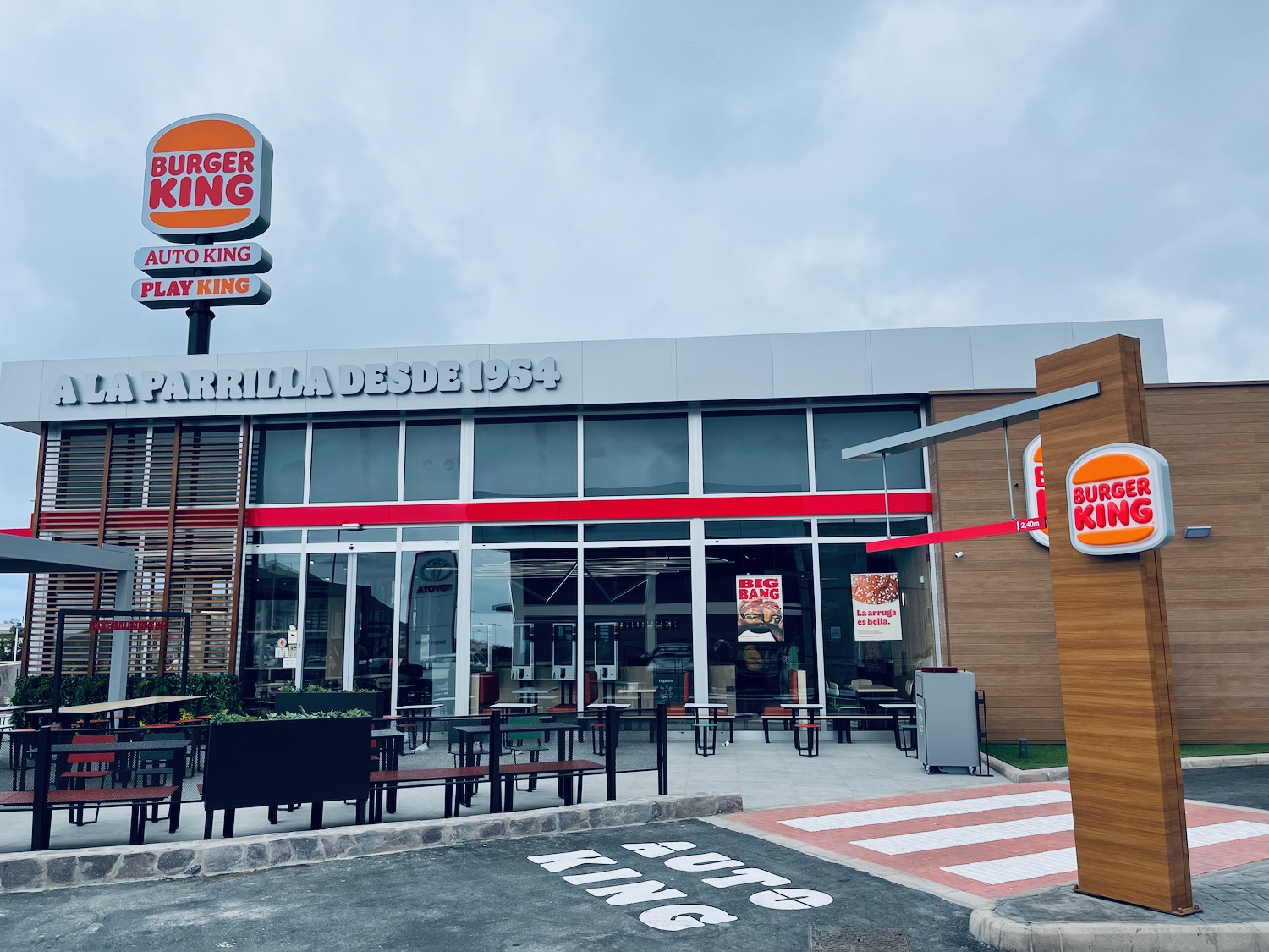a burger king restaurant with tables and chairs