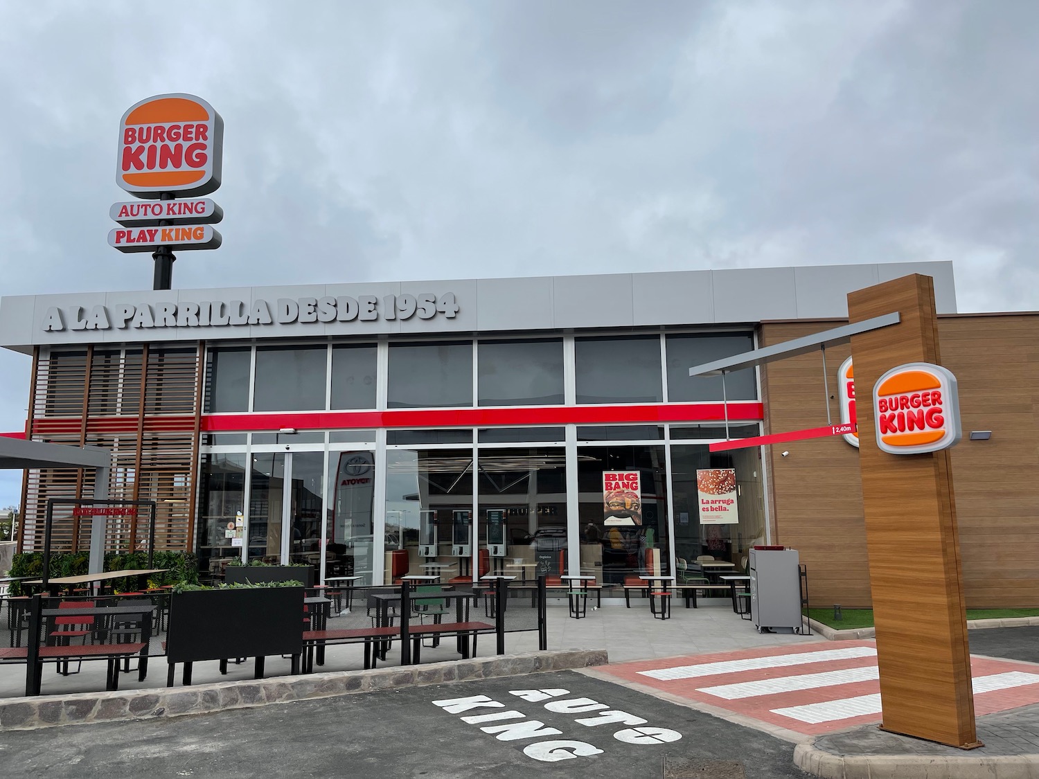 a burger king restaurant with tables and chairs