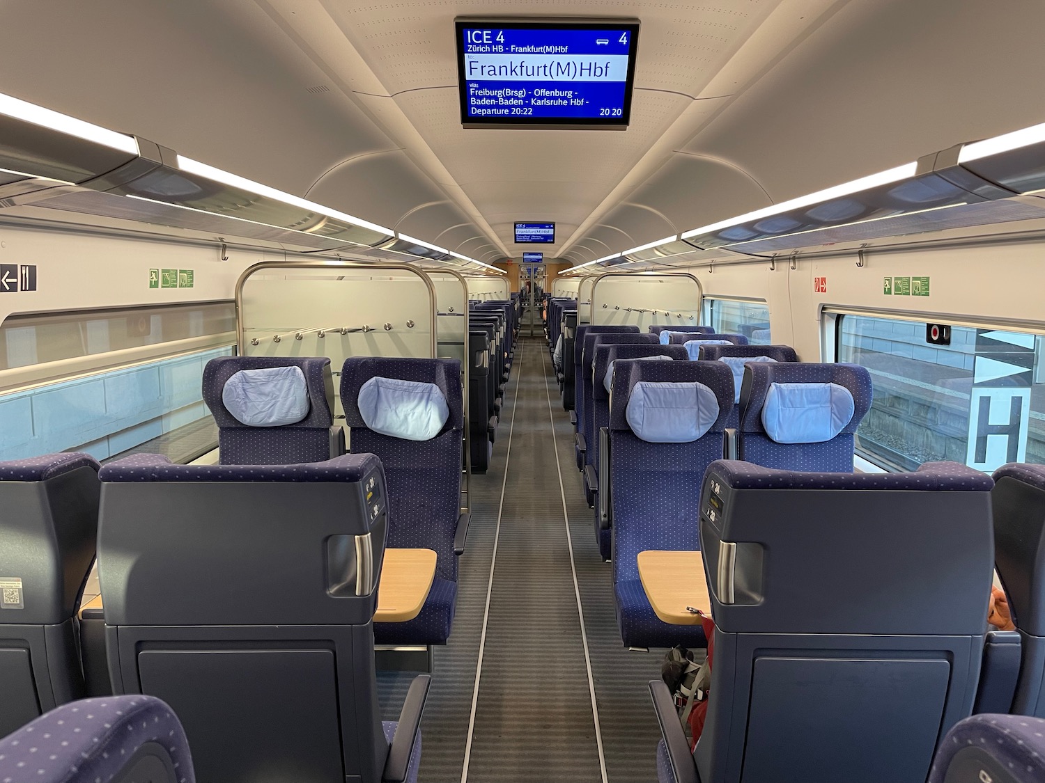 a train with seats and a screen