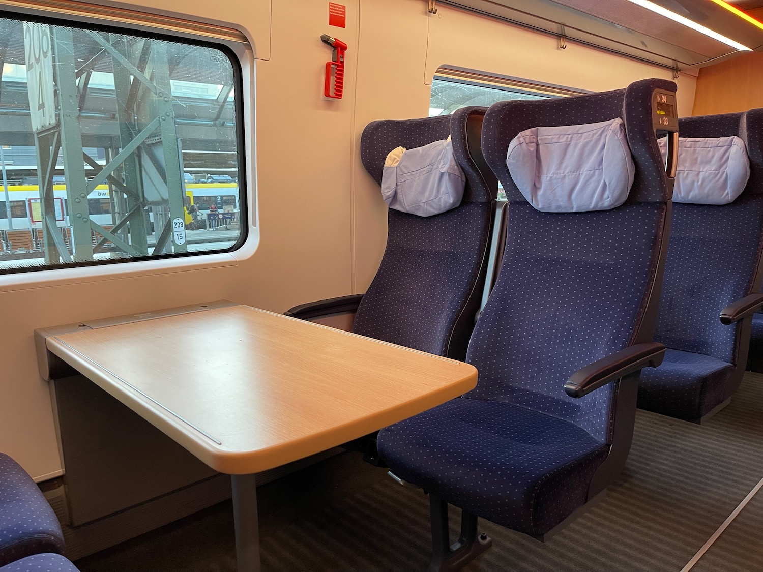 a table and chairs in a train