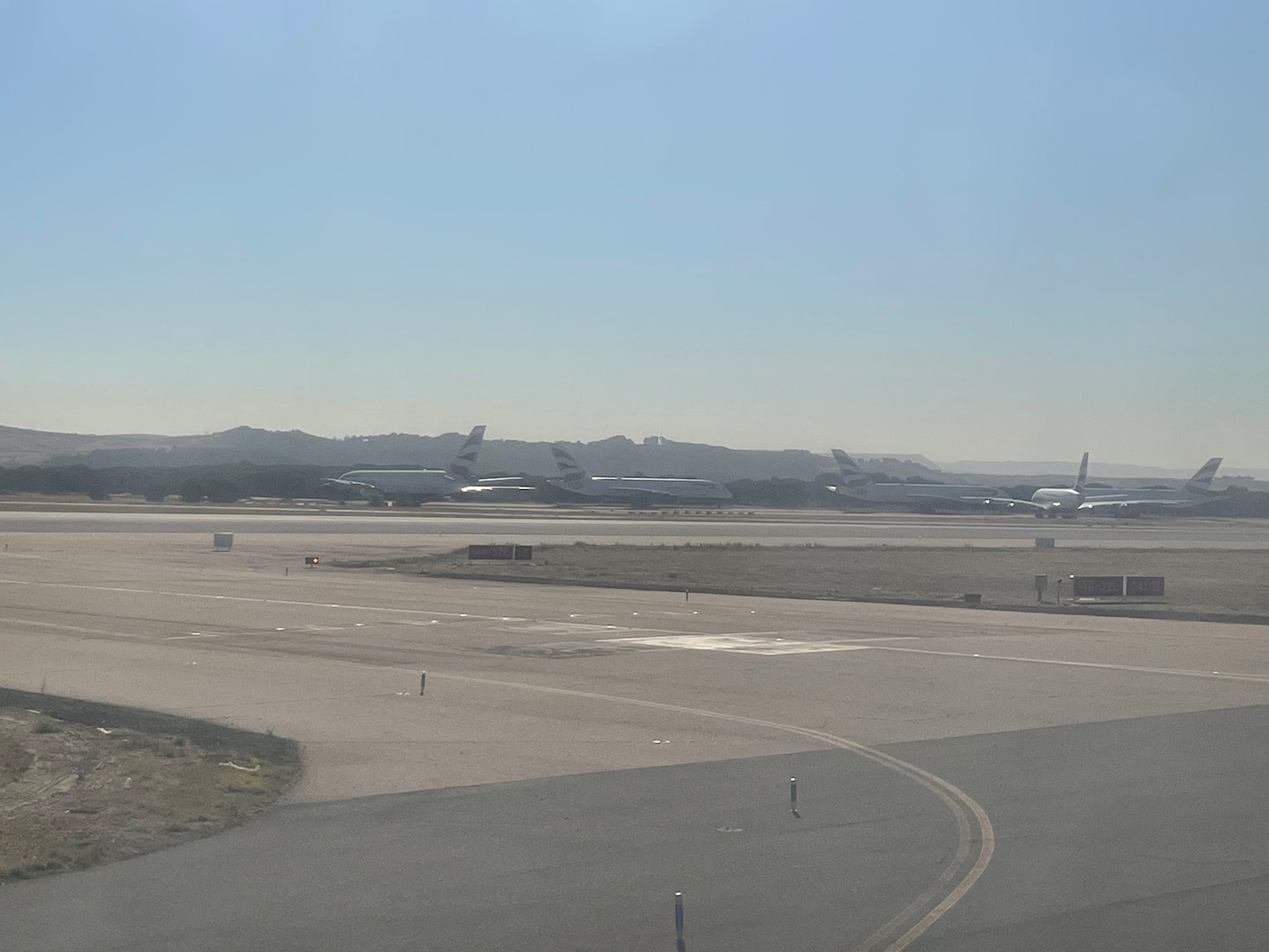 a group of airplanes on a runway