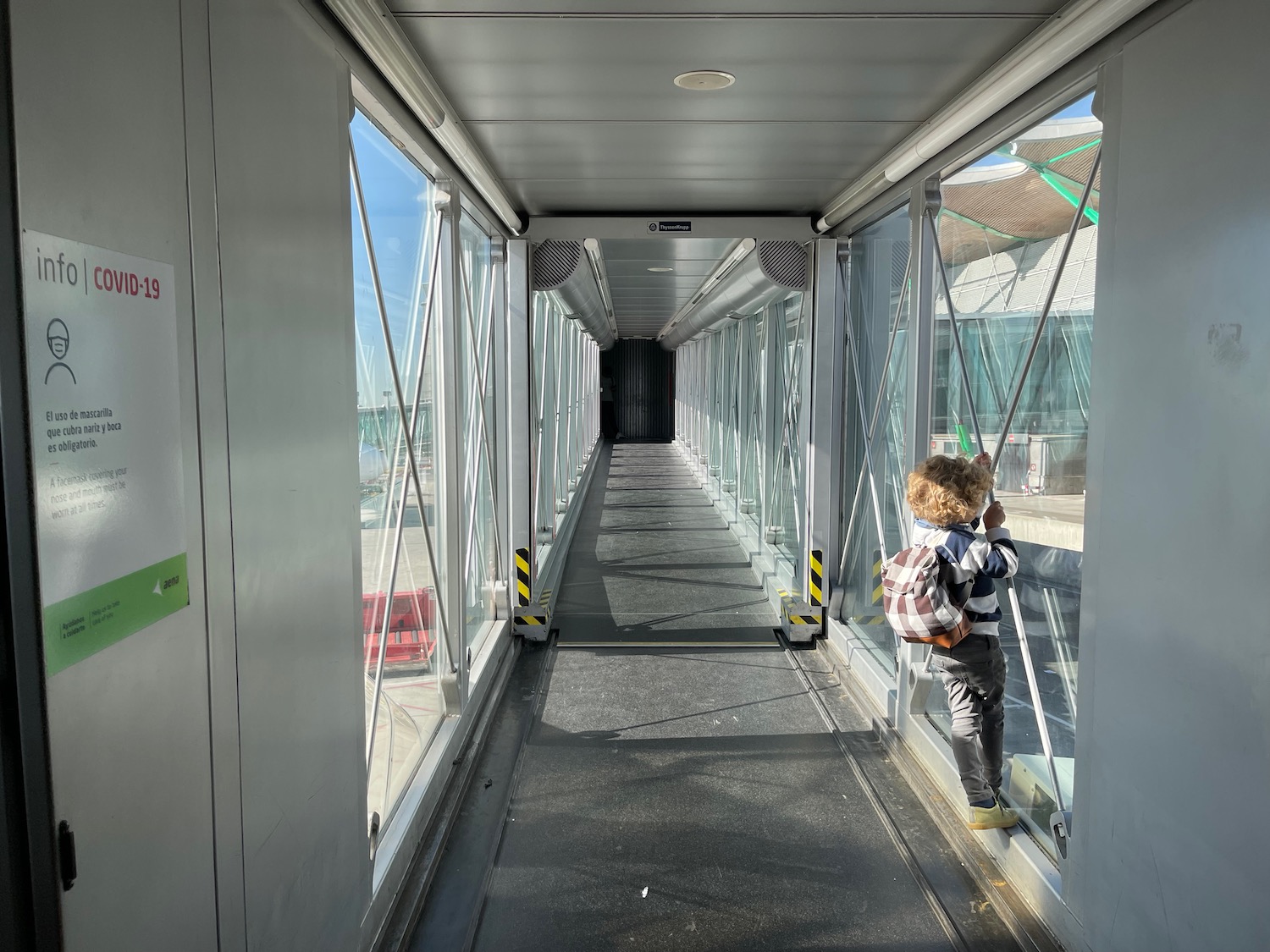 a child standing on a walkway