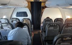 a group of people sitting in an airplane