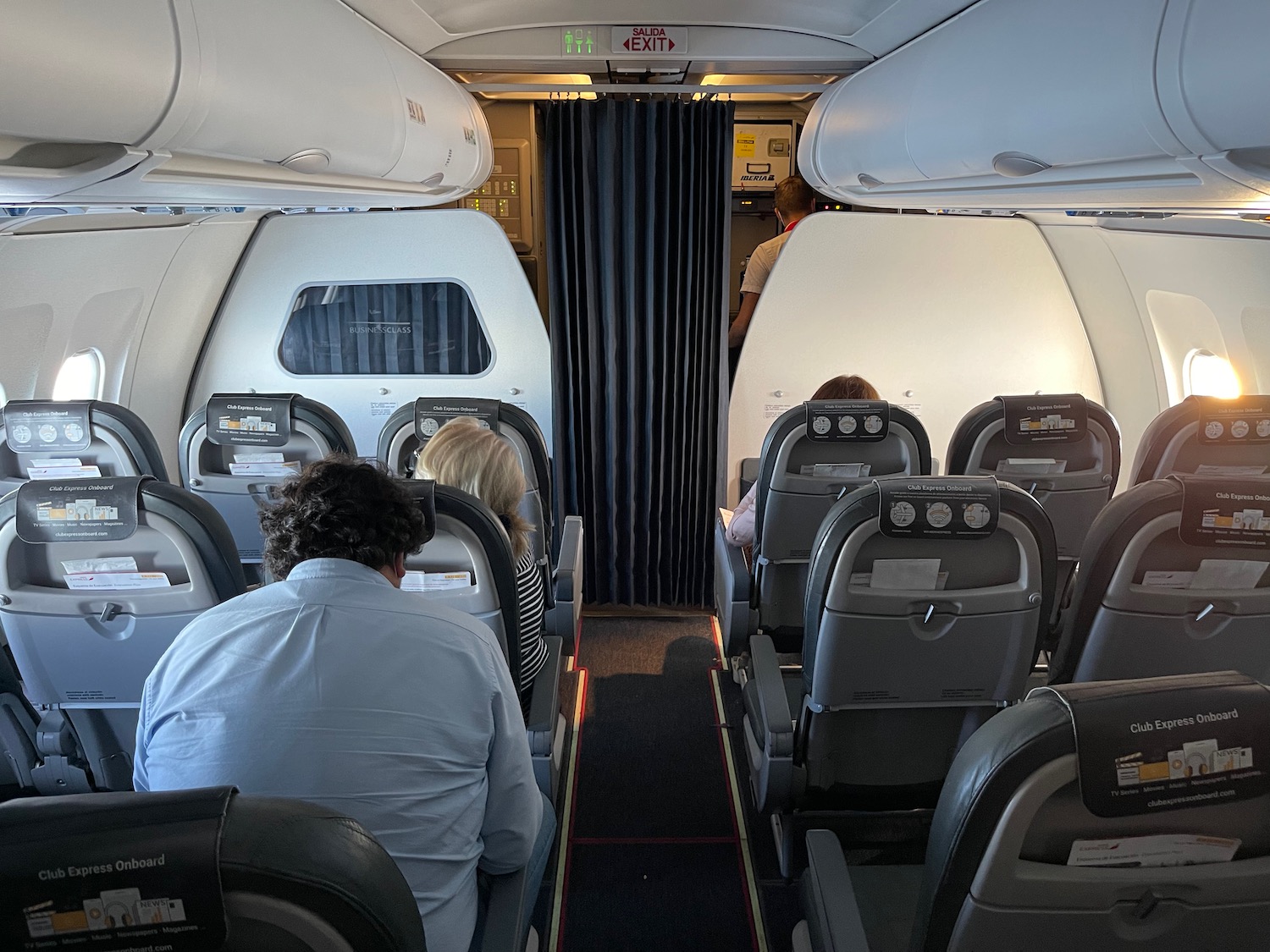 a group of people sitting in an airplane