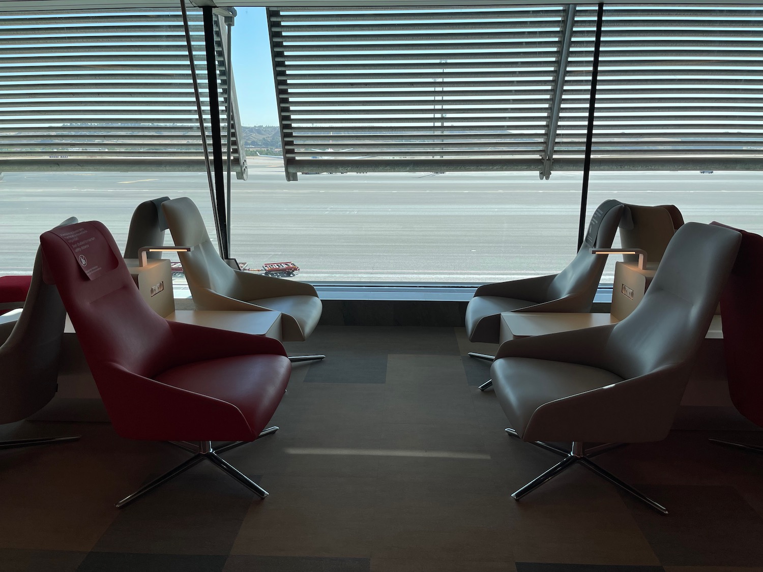 a group of chairs in a room with a window