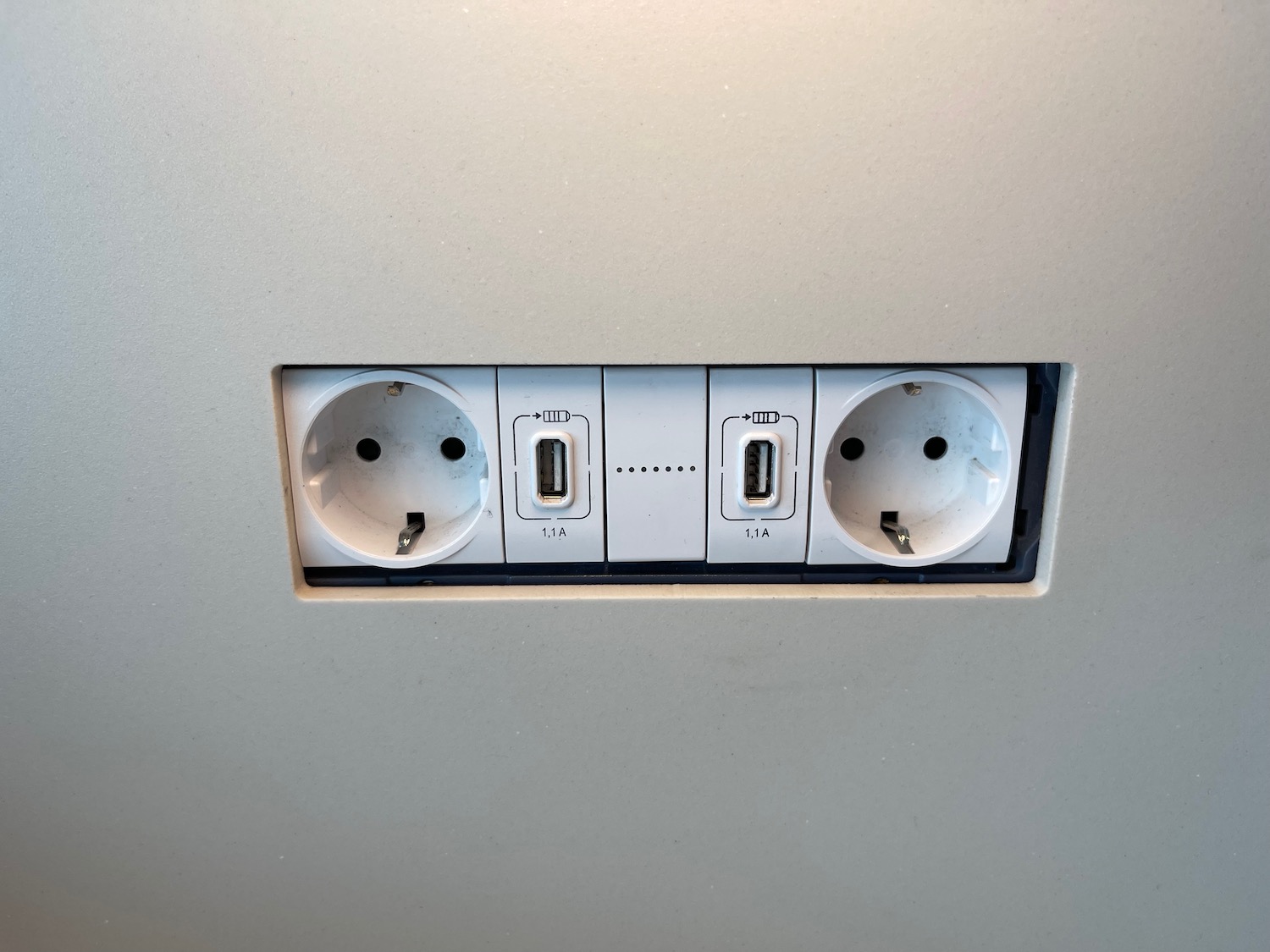 a white electrical outlet with a usb port