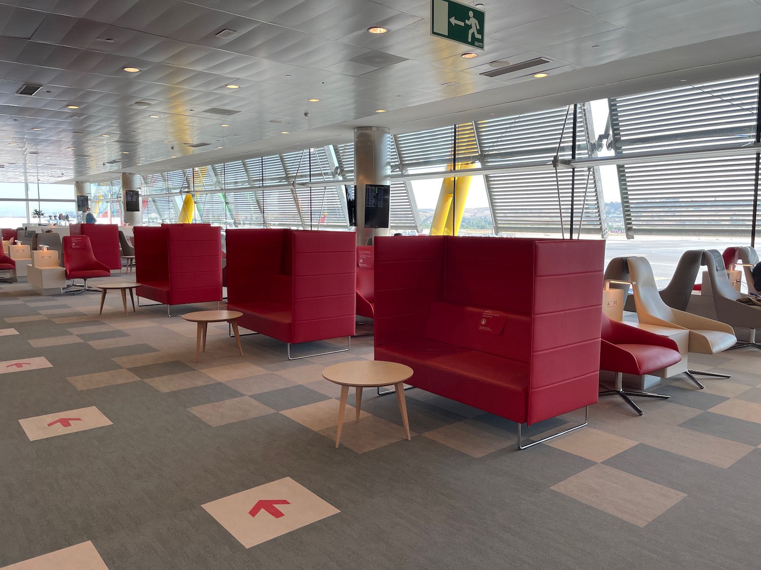 a red chairs and tables in a room