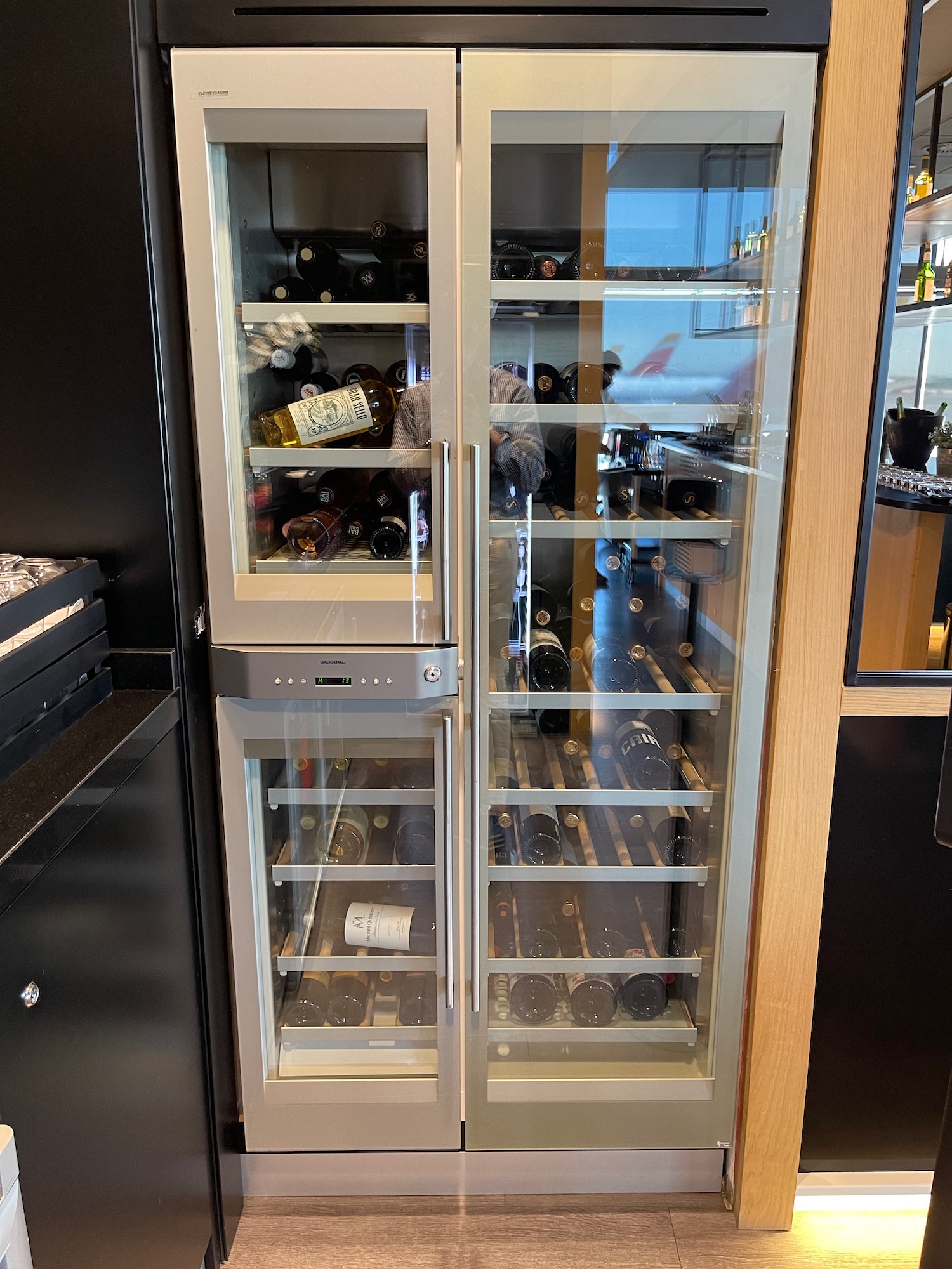 a wine fridge with glass doors