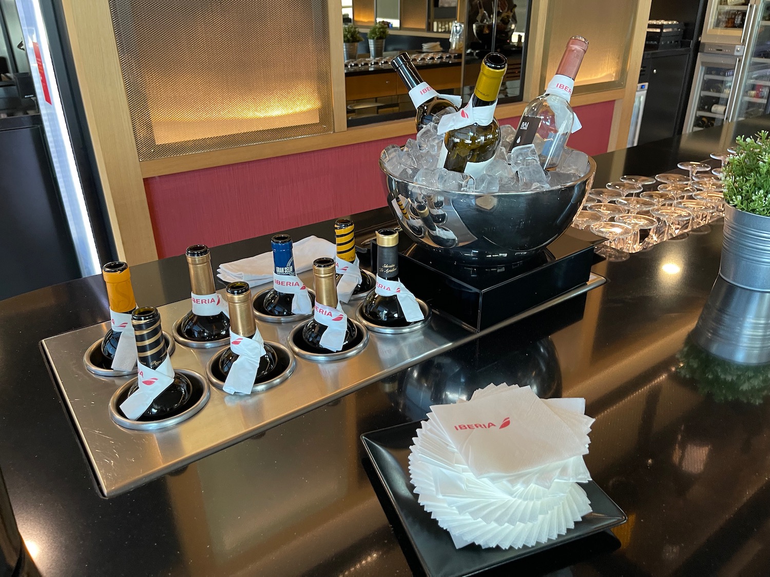 a group of bottles in a bowl of ice on a table