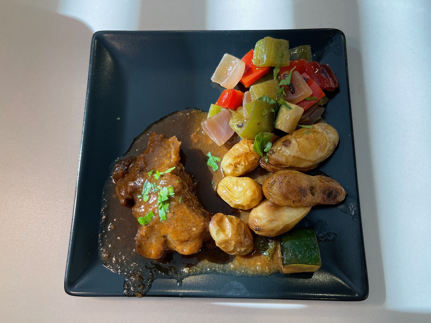 a plate of food on a white surface