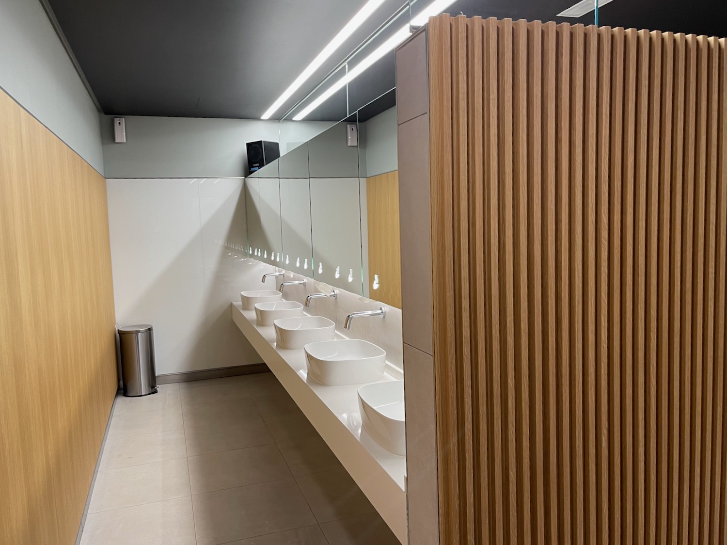 a bathroom with sinks and mirrors