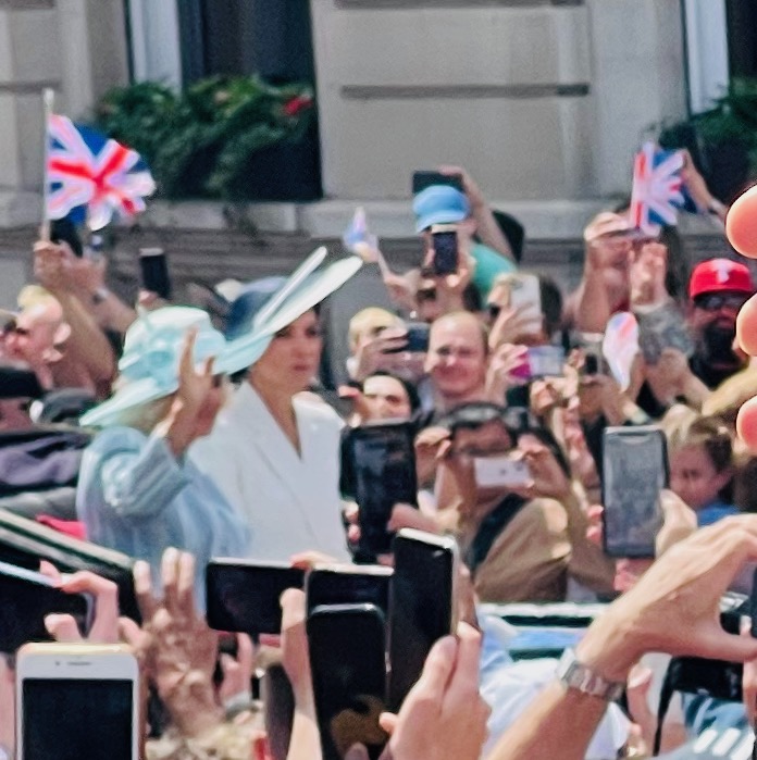 a group of people holding up their phones