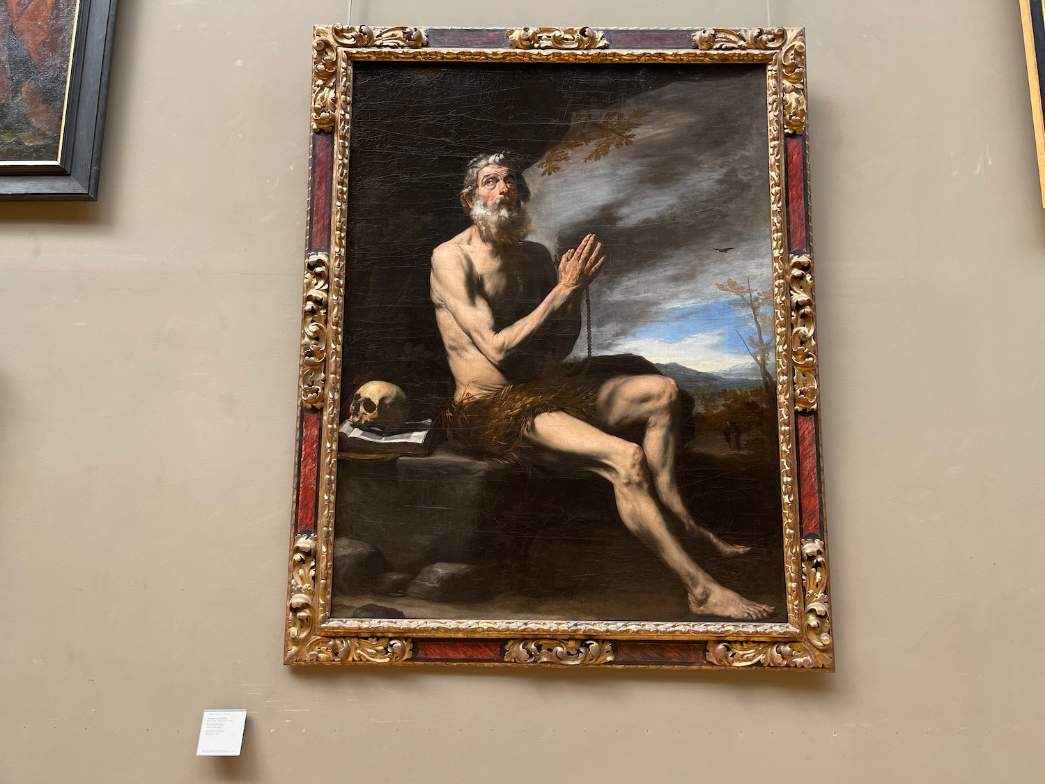 a painting of a man in a gold frame