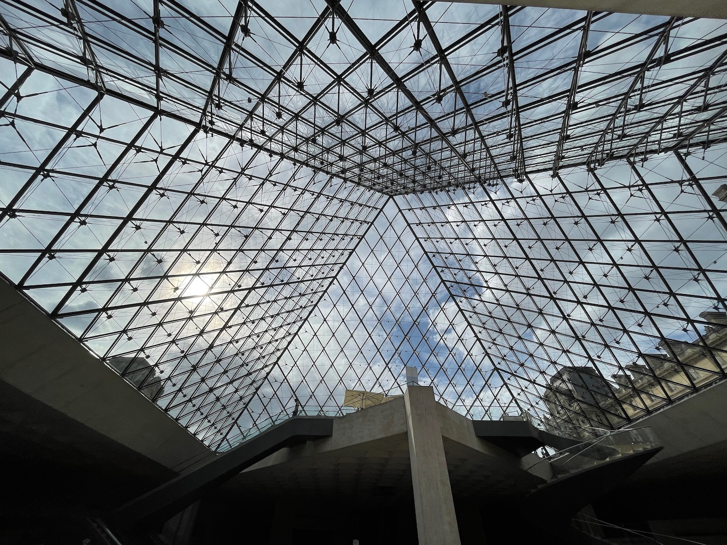 a glass pyramid with a staircase and a staircase