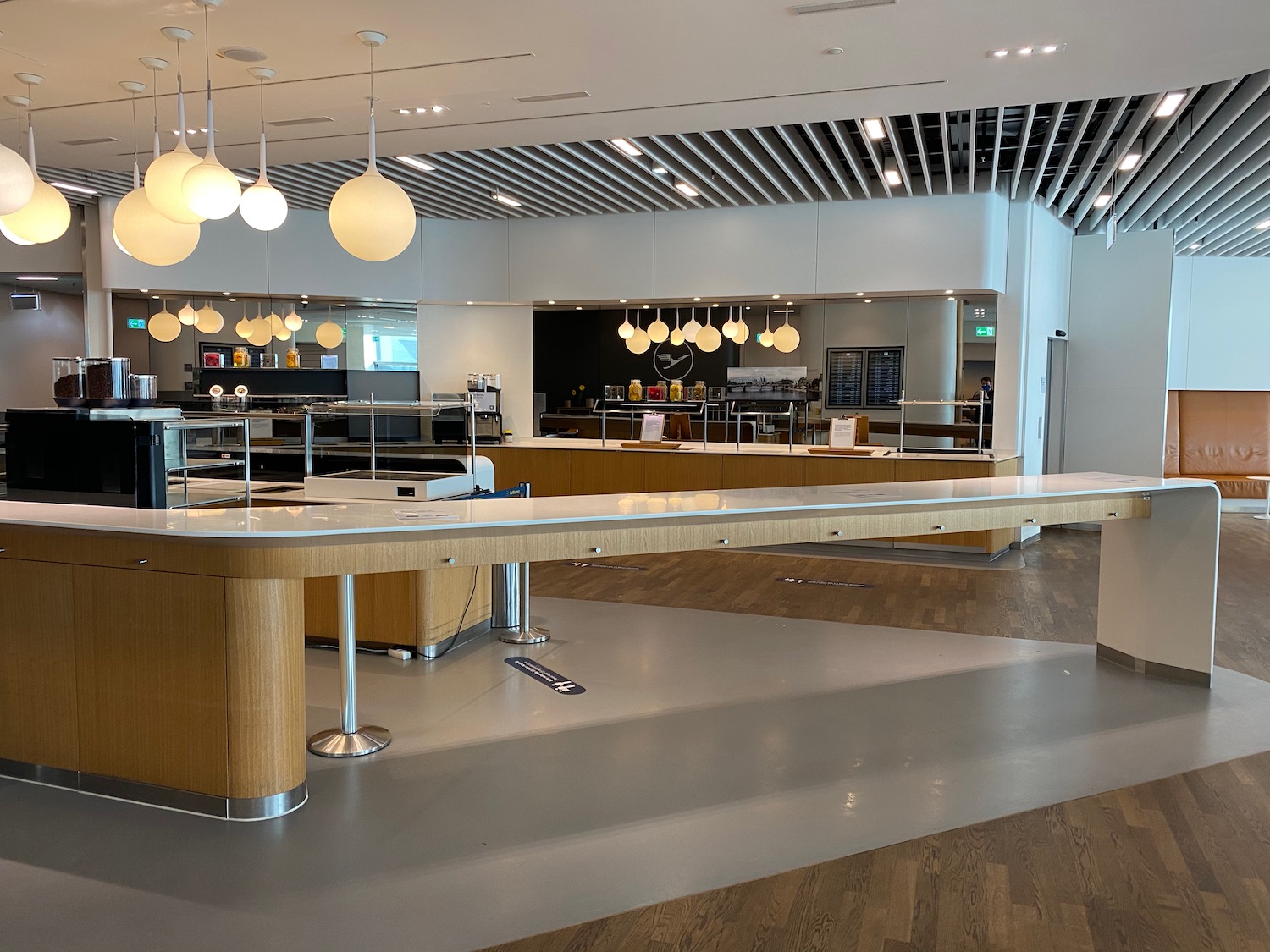 a large room with a counter and a bar