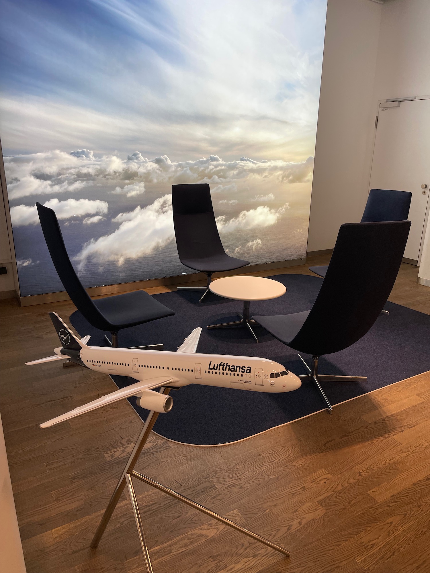 a plane in a room with chairs and a table