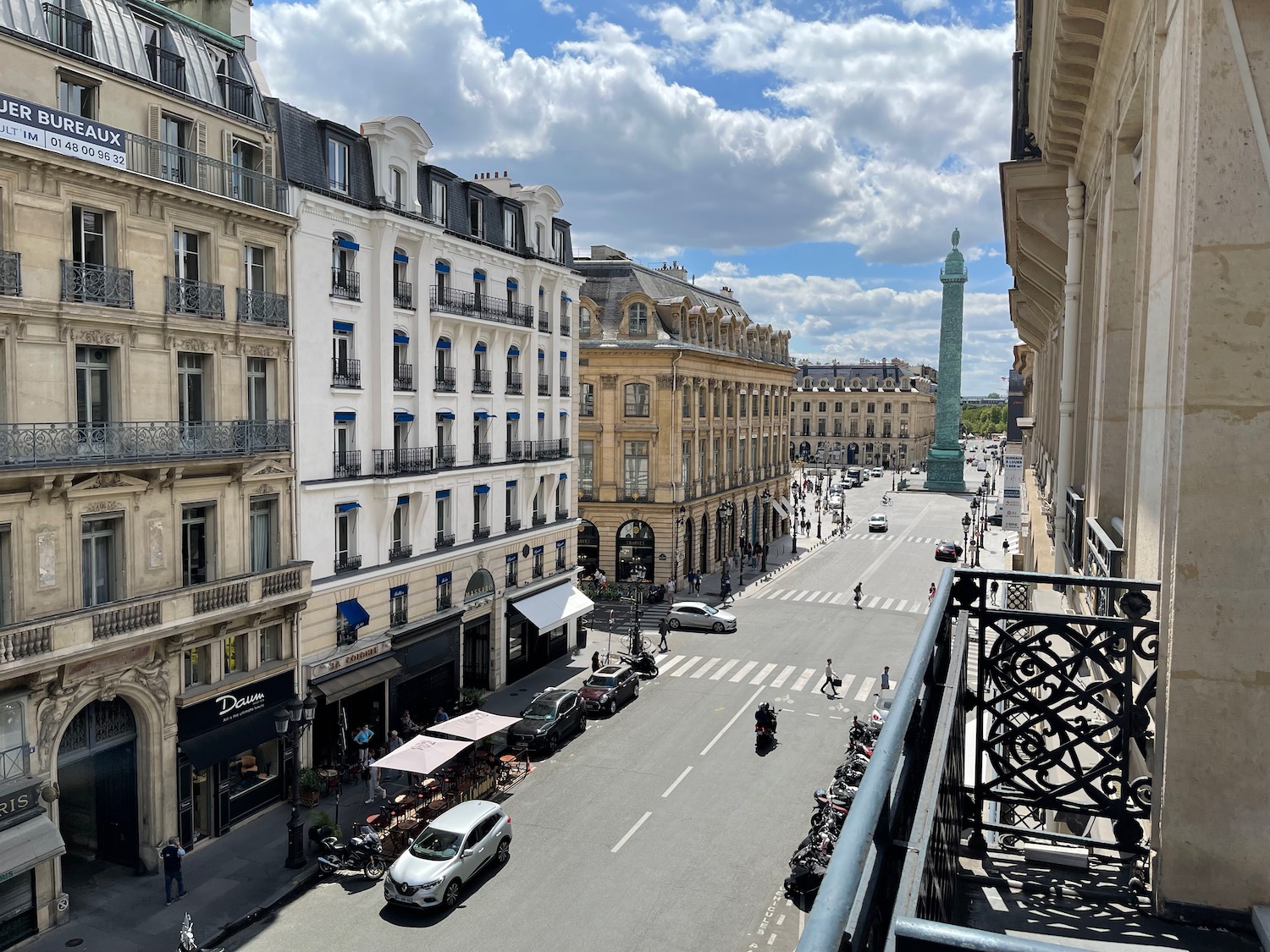 a street with cars and buildings