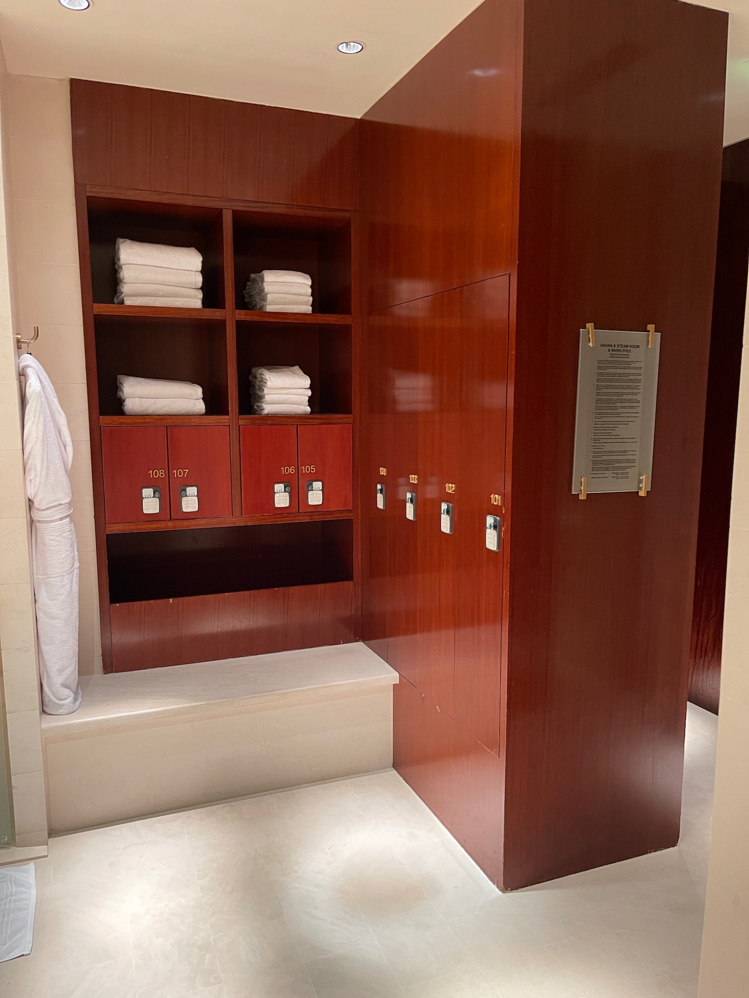 a bathroom with towels on shelves