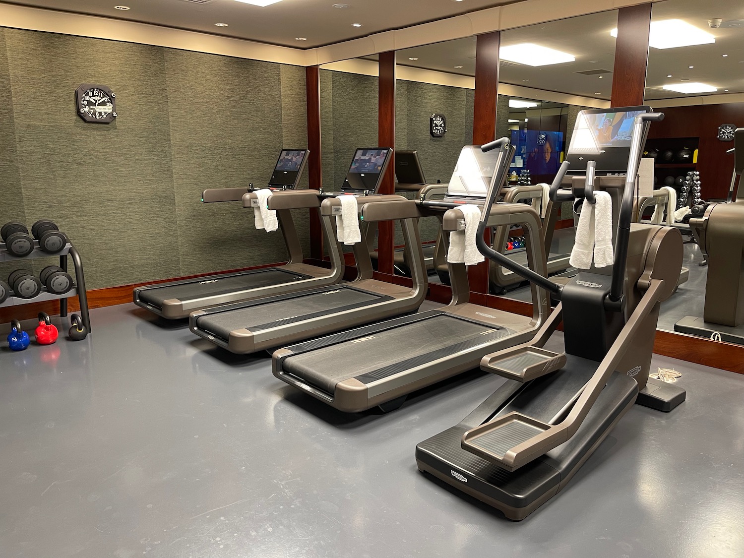 a group of treadmills in a gym