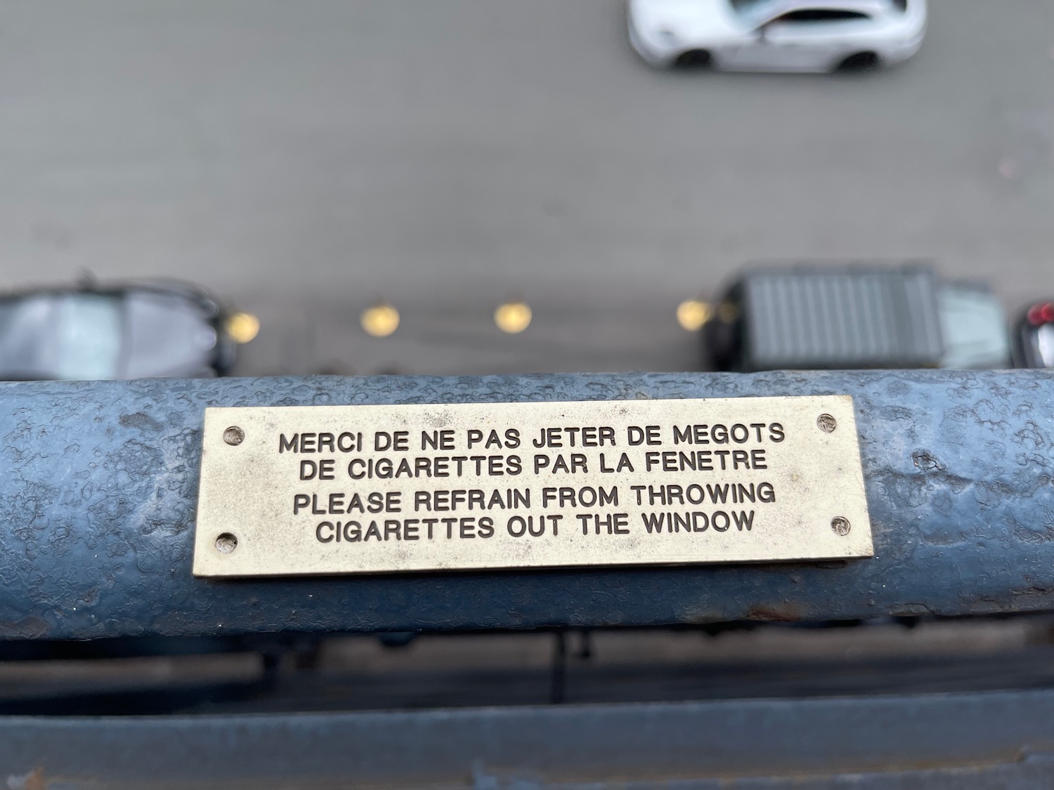 a sign on a railing