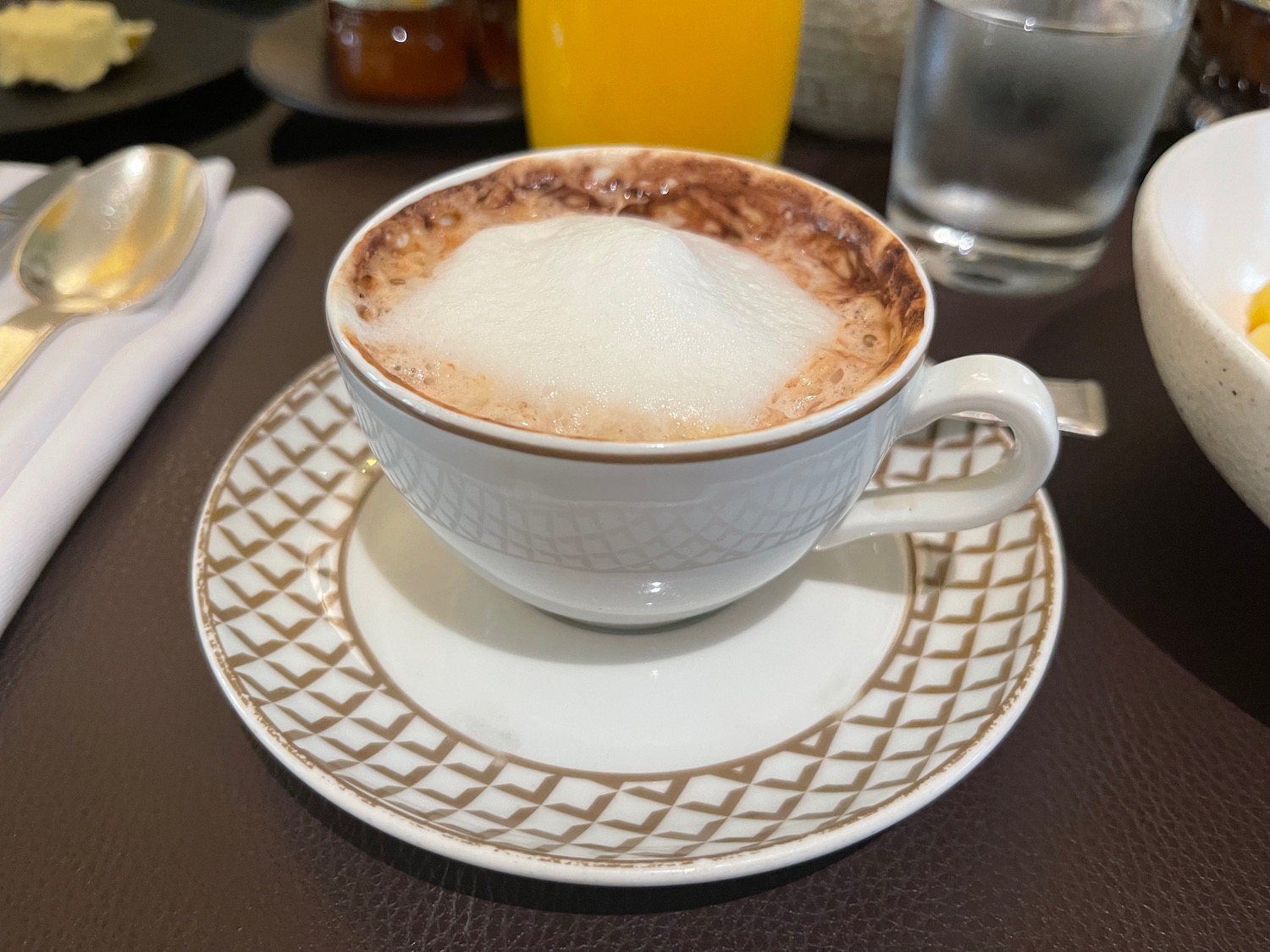 a cup of coffee with foam in it