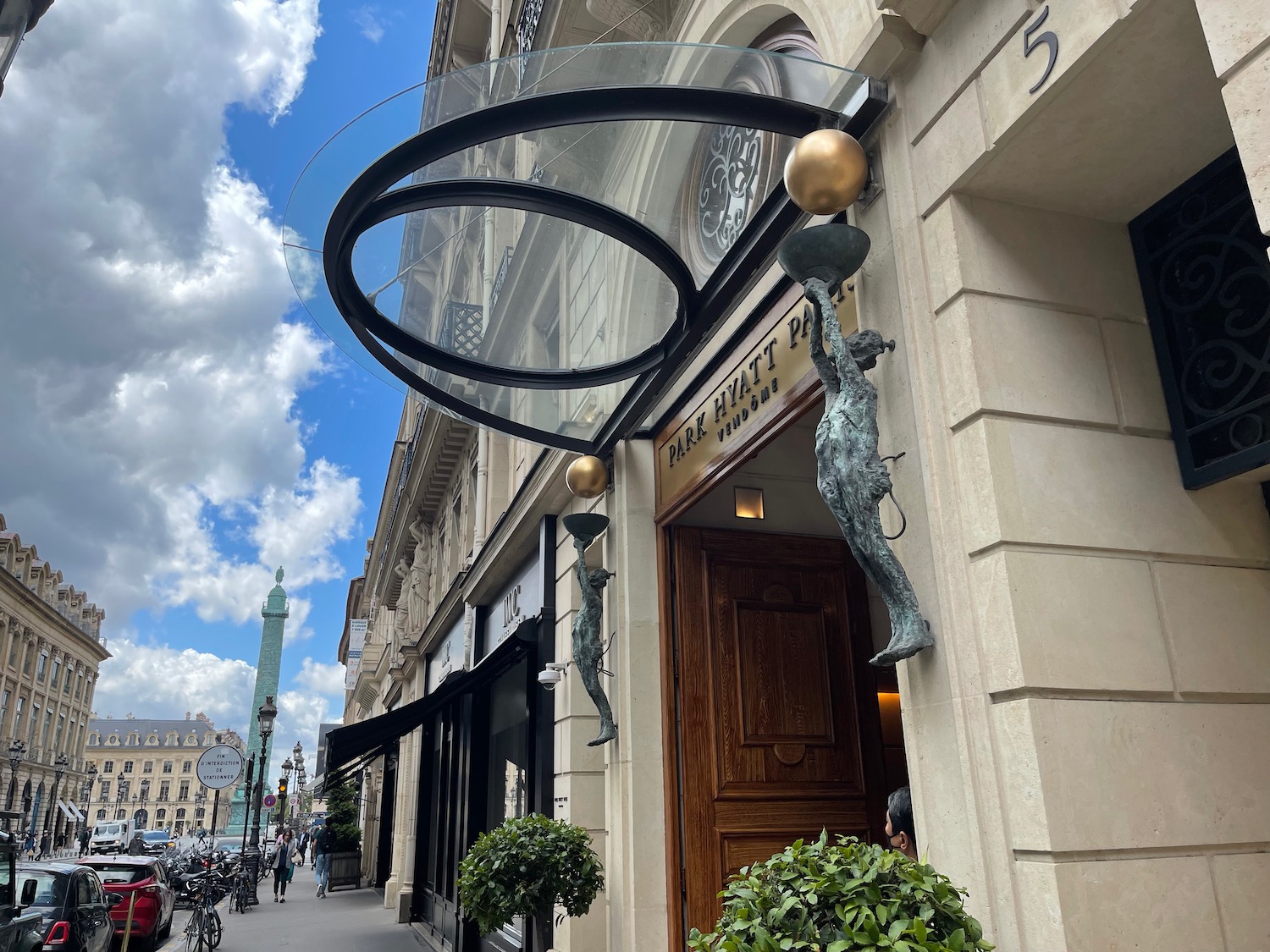 a building with a glass canopy over a door