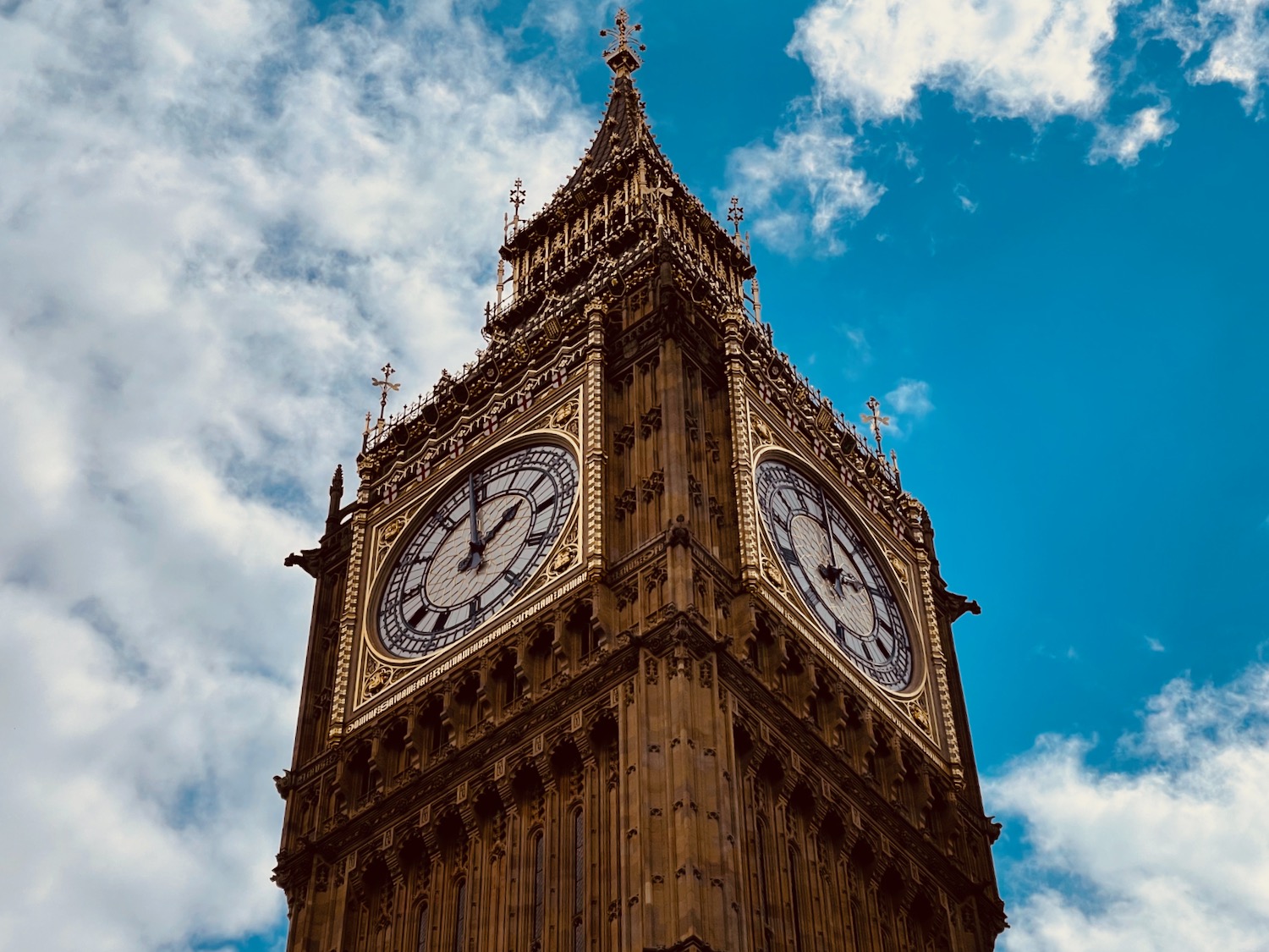 a clock tower with a blue sky