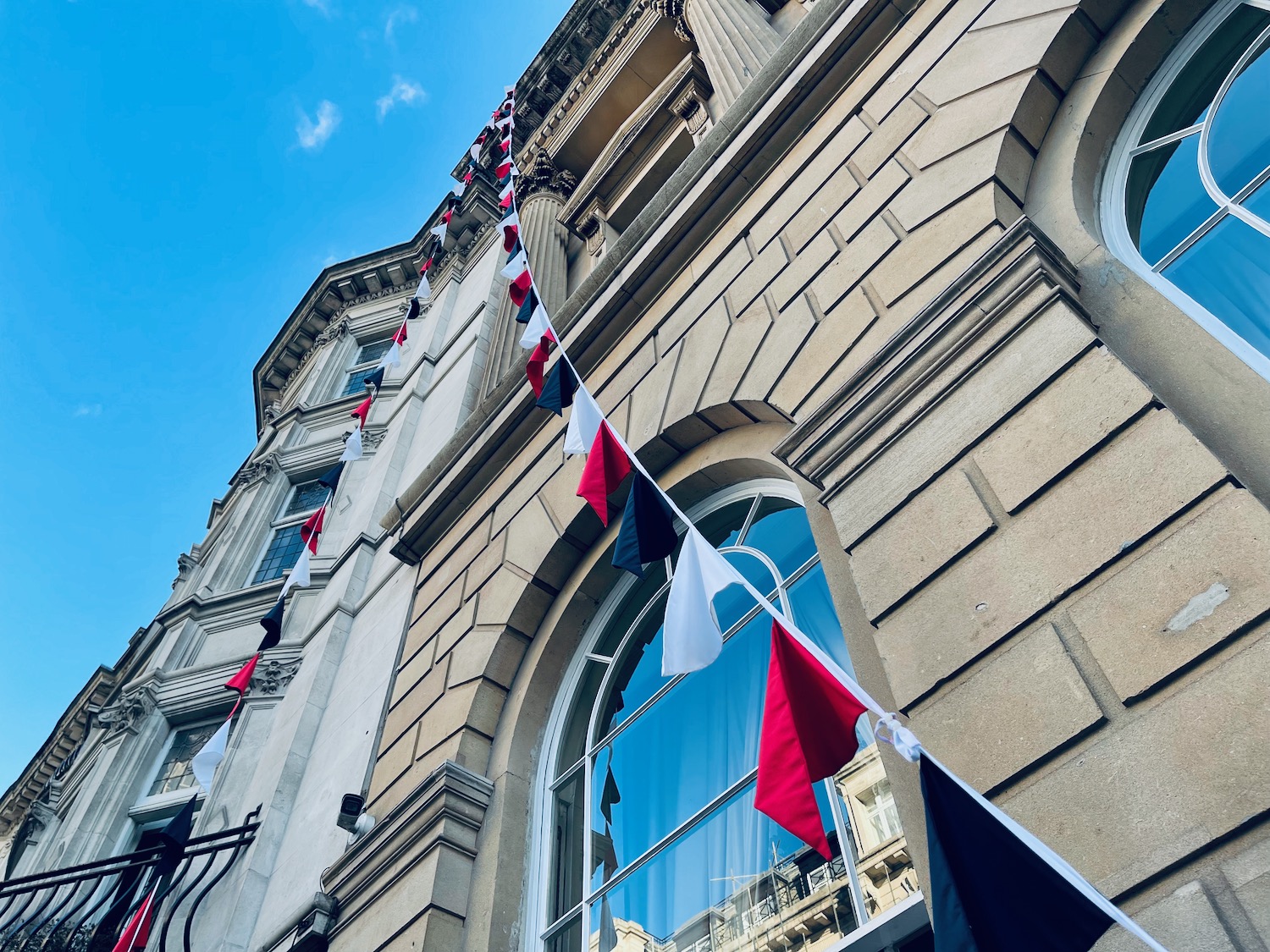 a building with a row of flags