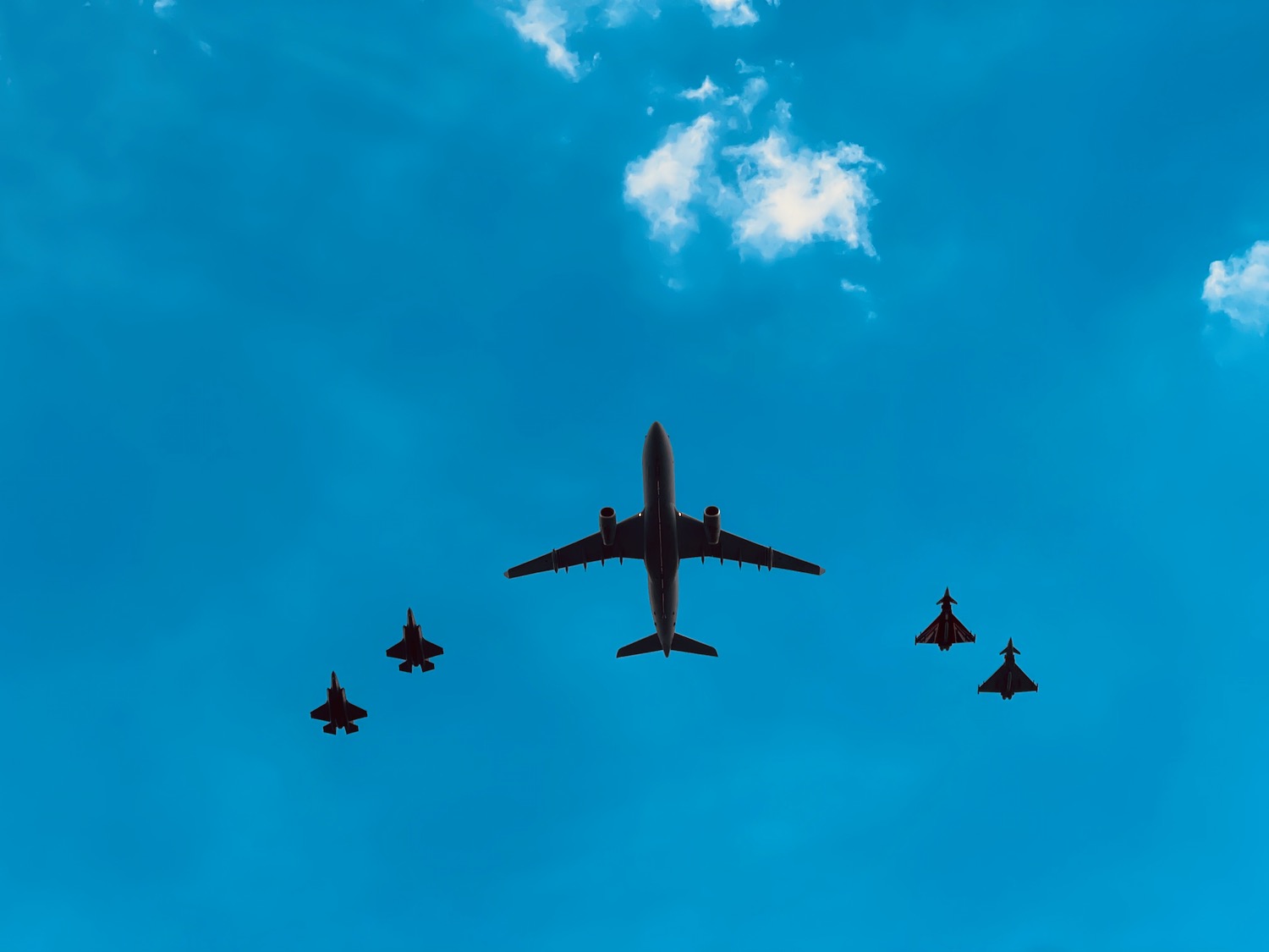 a group of airplanes flying in the sky