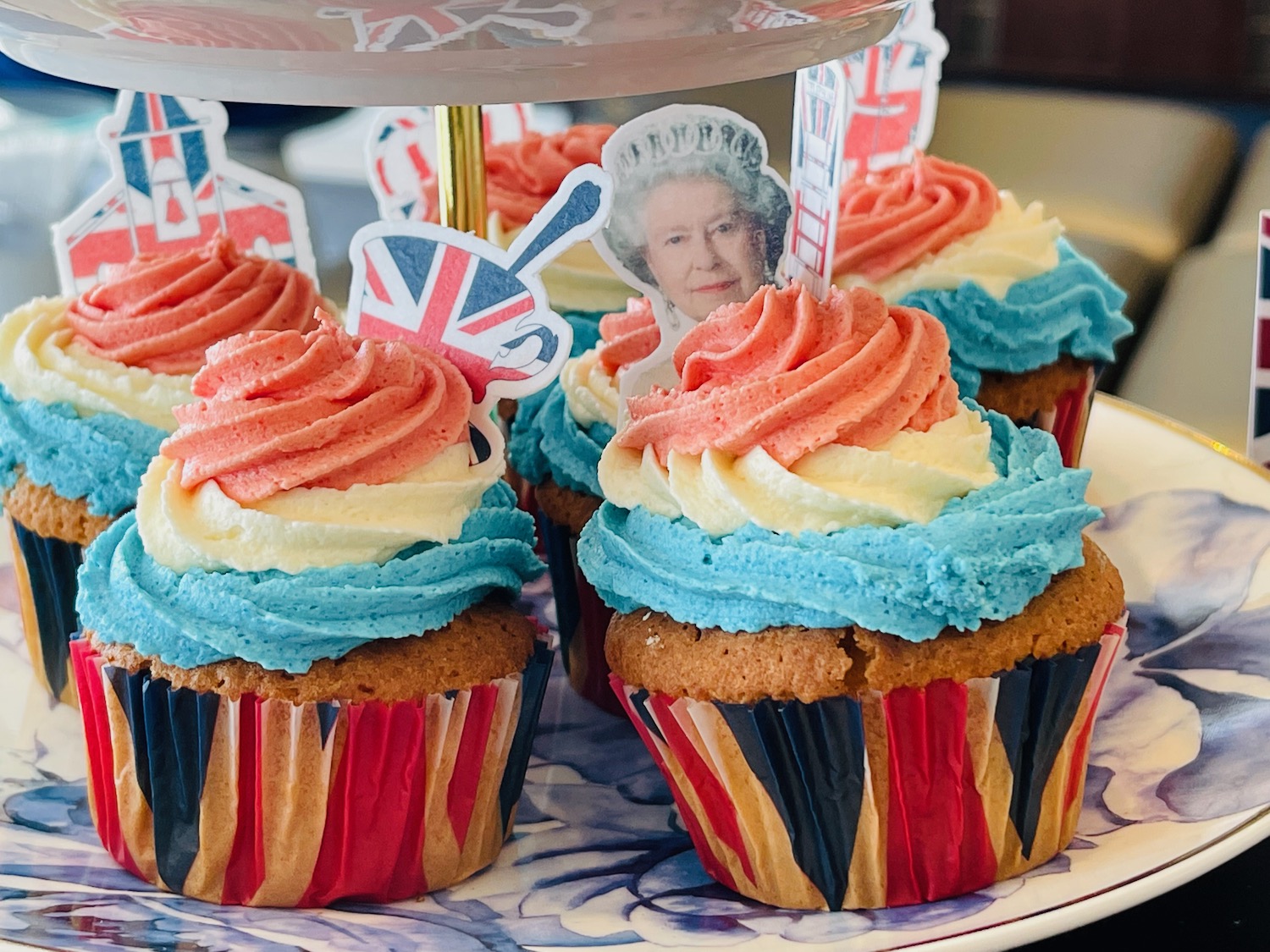 cupcakes with a picture of queen on top