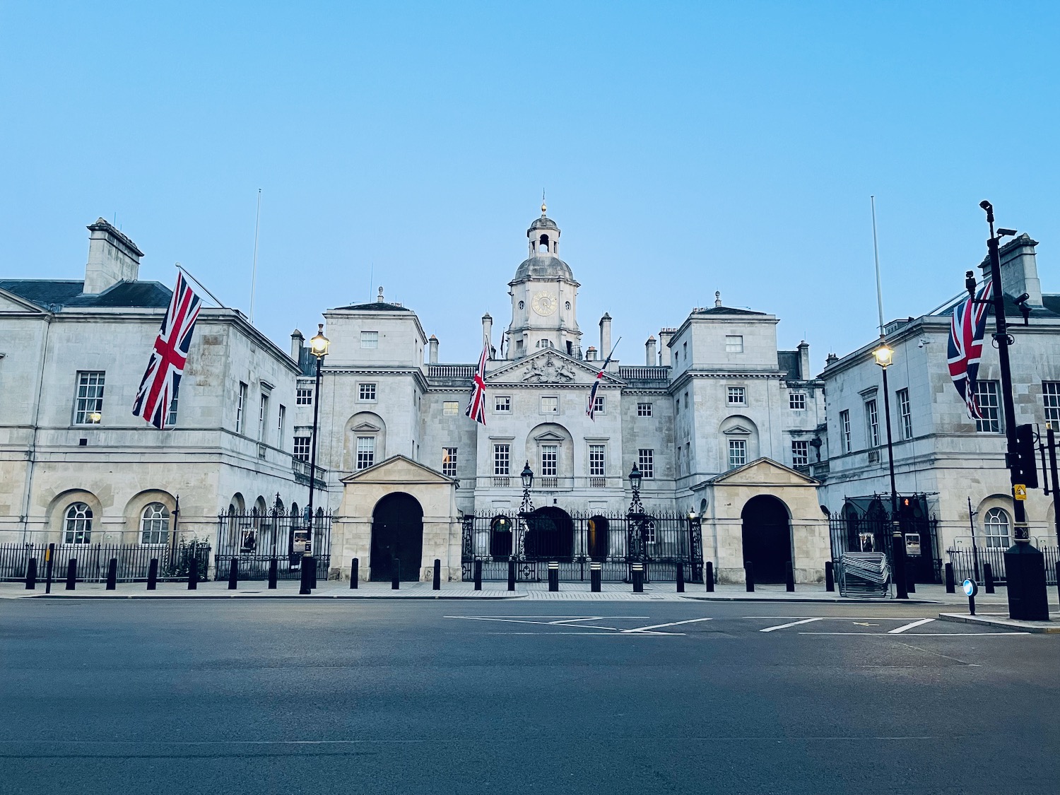 a large white building with flags on it