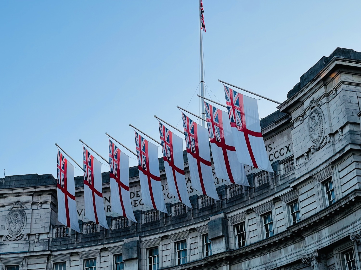 a group of flags on a pole