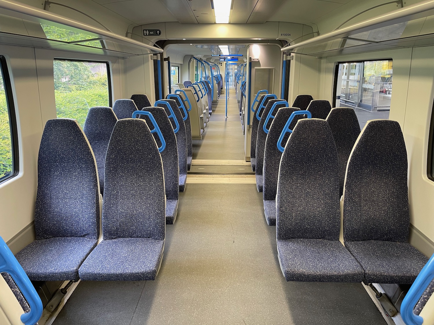 a train with seats and blue handles