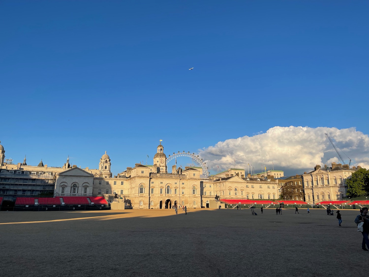 a large square with buildings and a ferris wheel