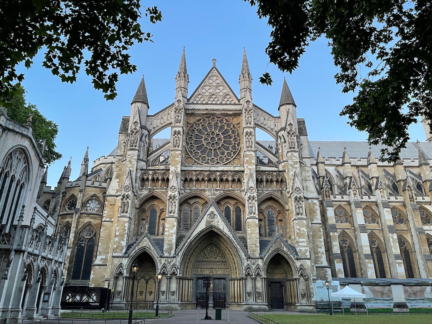 a large building with a large window with Westminster Abbey in the background