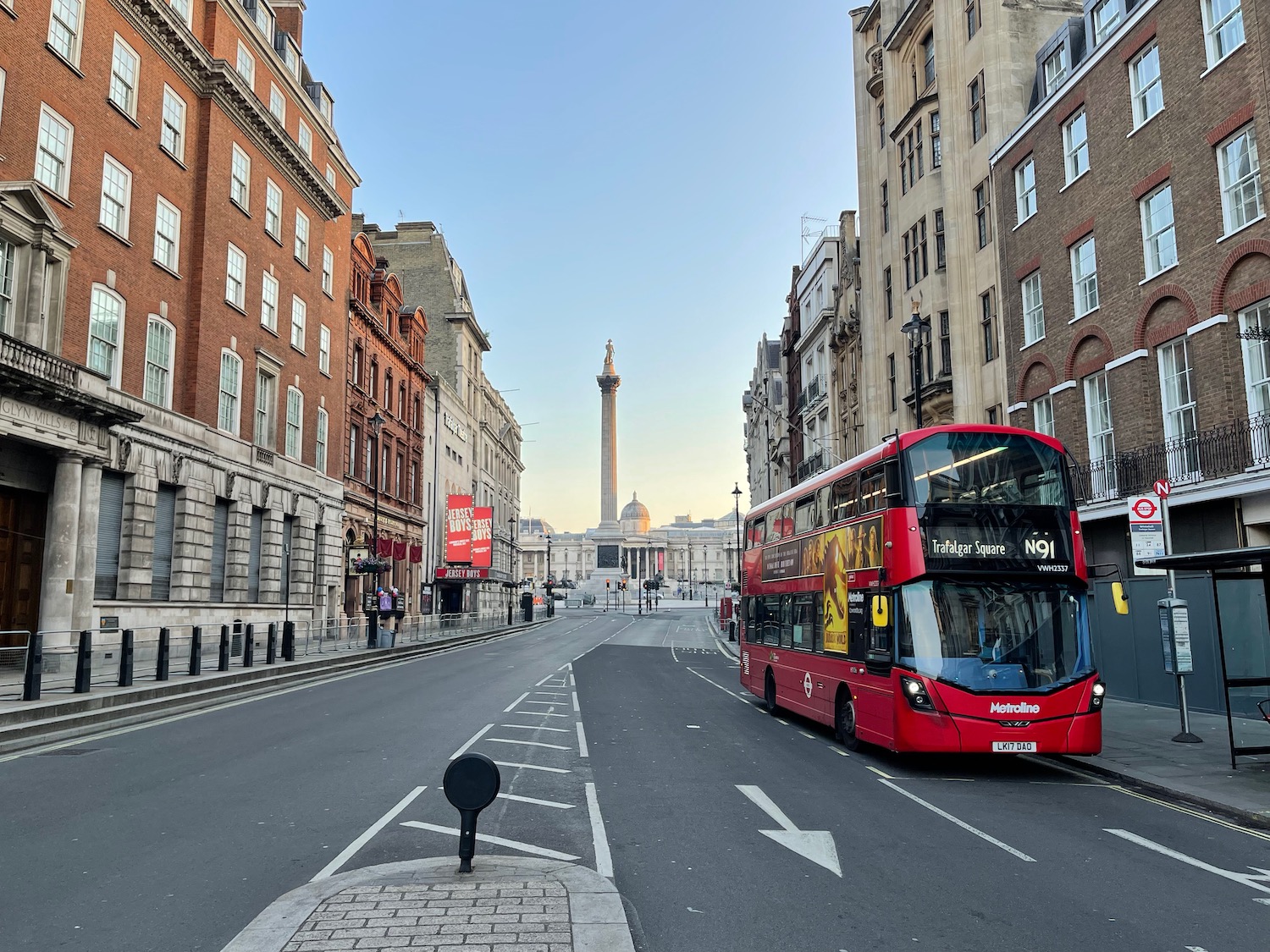 a double decker bus on a street in a city