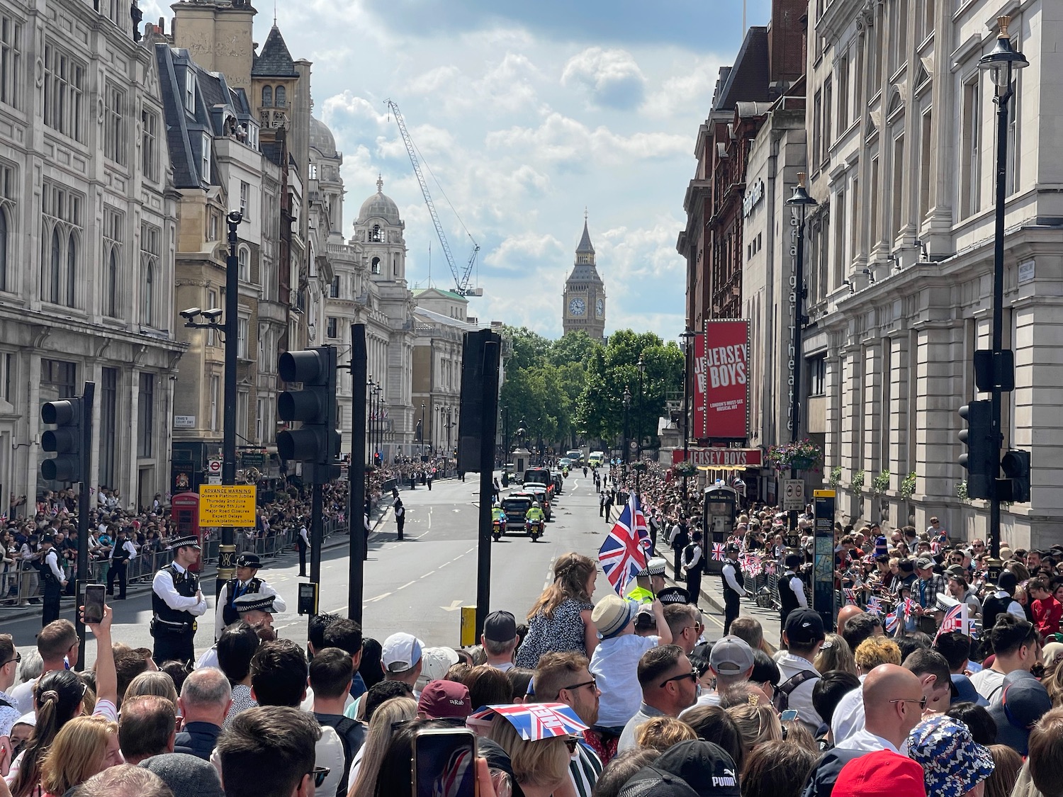 a crowd of people in a street