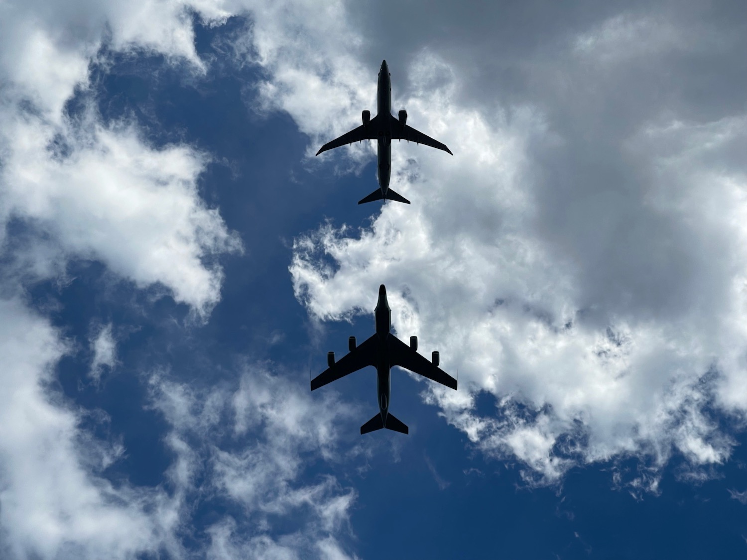 two airplanes flying in the sky