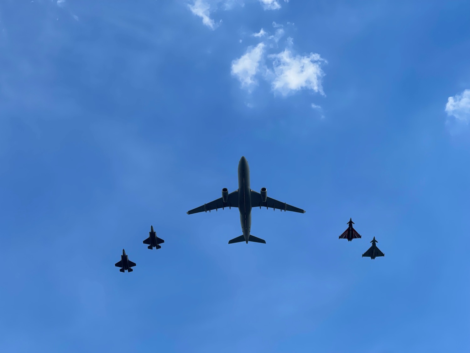 a group of airplanes flying in the sky