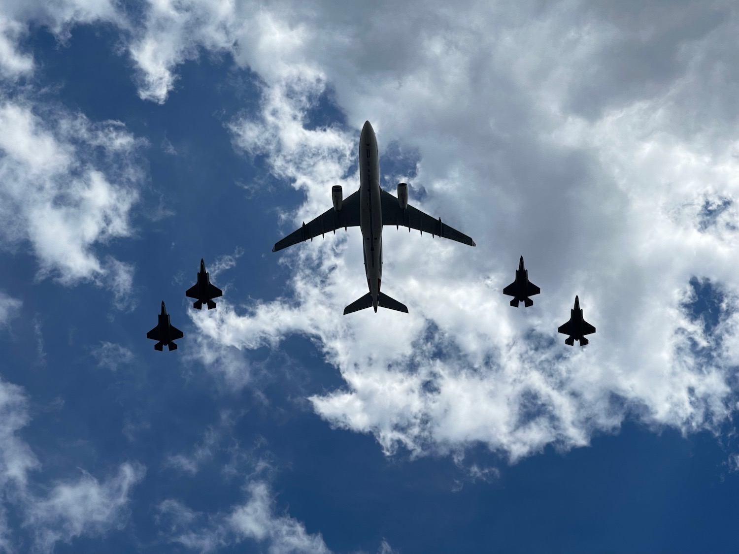 a group of airplanes flying in the sky