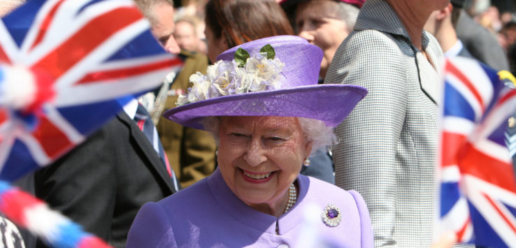 a woman in a purple hat and purple coat
