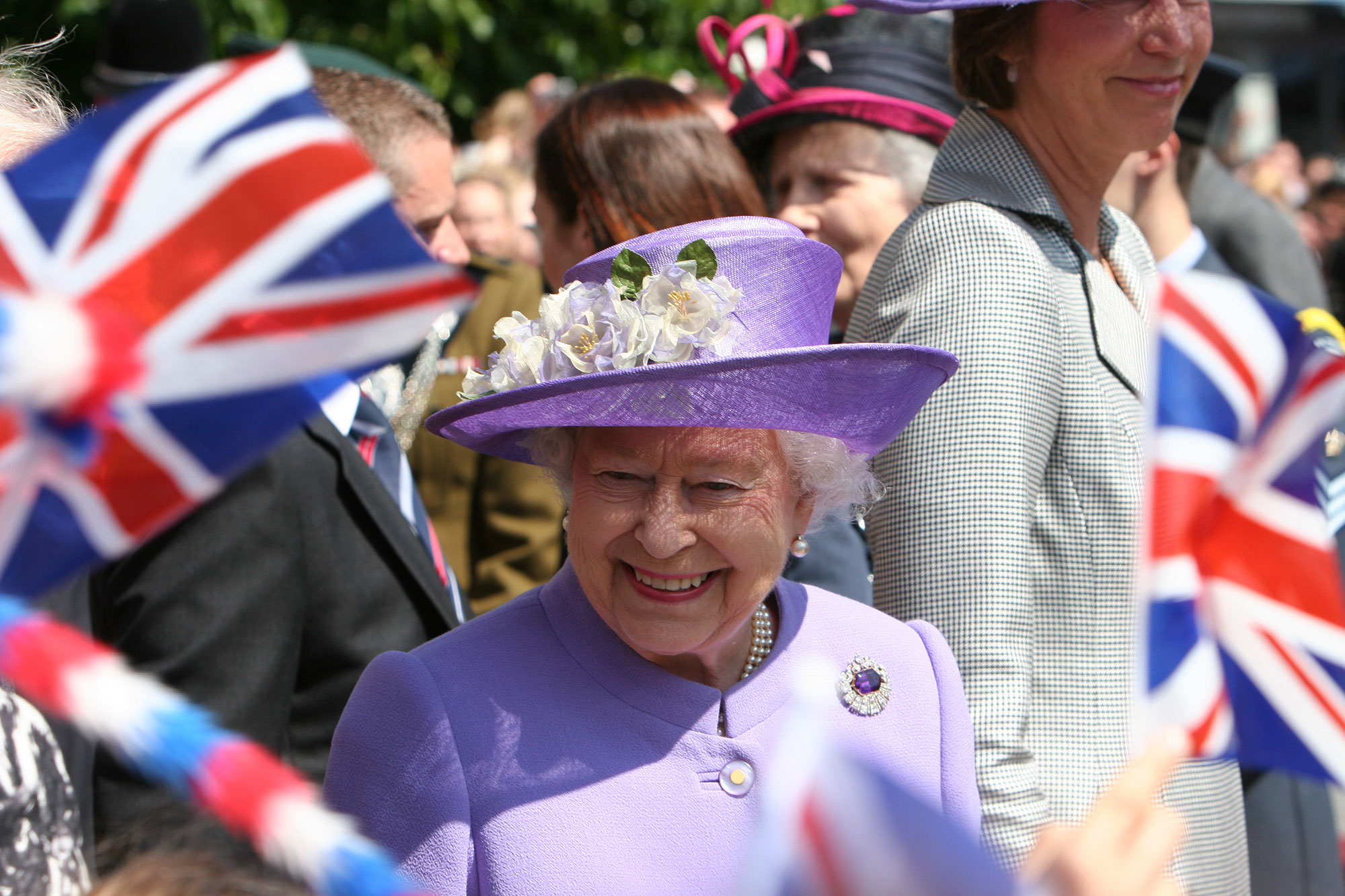 a woman in a purple hat and purple coat