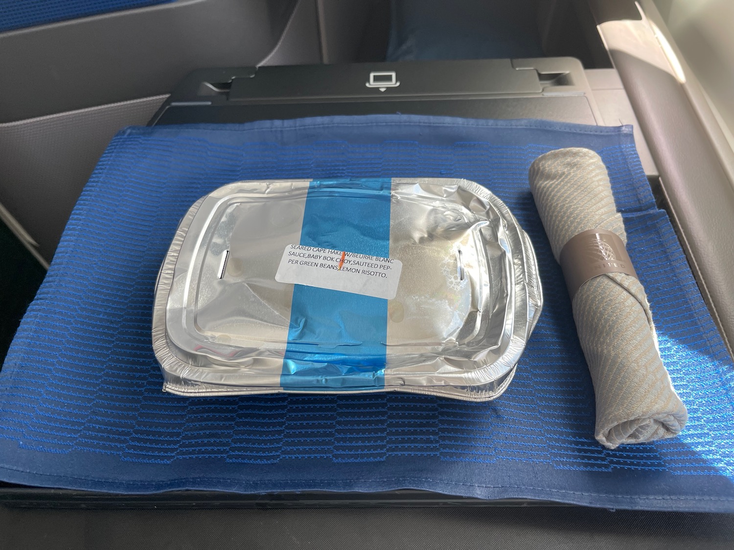 a tray of food on a blue mat