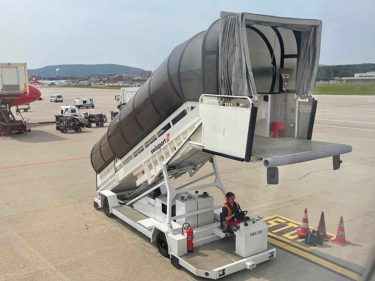 a man sitting on a luggage carrier