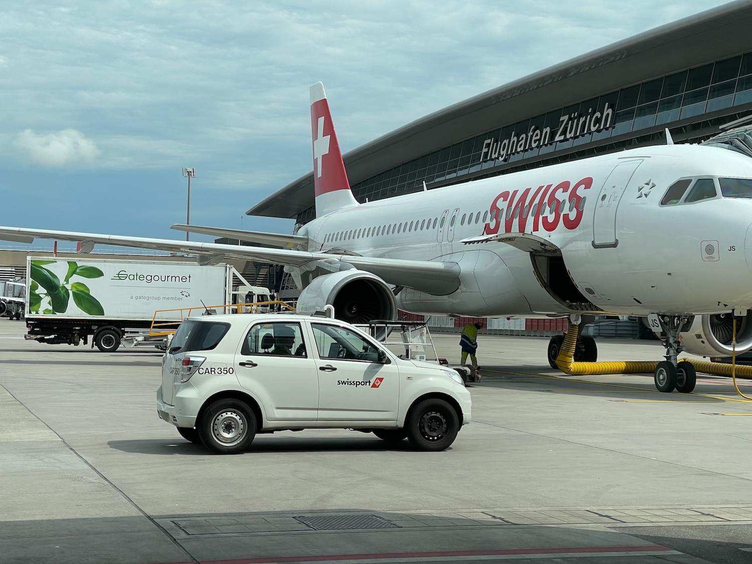 a white car and a plane